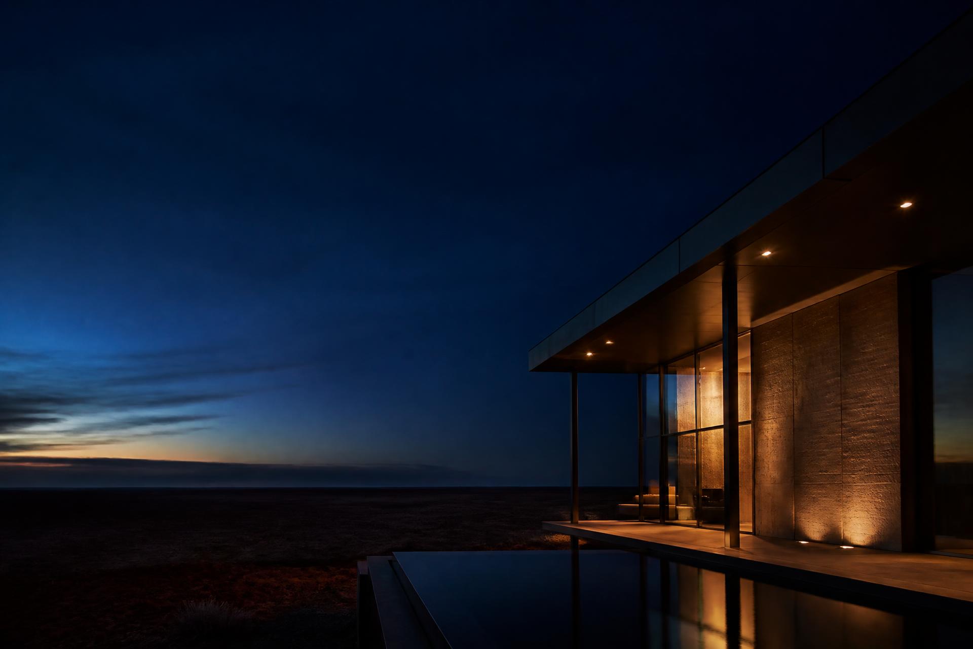 Contemporary Australian architecture beneath a deep blue night sky